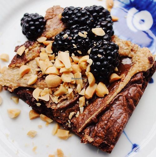 Brownie with peanutbutter frosting swirl and blackberries at Yellow Rose in Copenhagen
