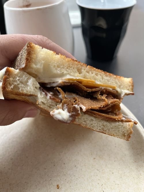 Ham, cheese and tomato toastie with aioli   at Shift Eatery in Surry Hills