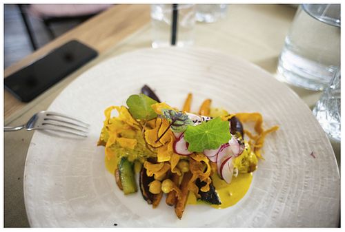 "Crazy Chickpea" House made Seitan with Checkpea, turmeric salsa and fresh veggies. at Gaudi&Naan in Ljubljana