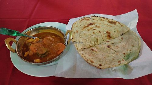 Vegetables Jalfrezi and Lacha Paratha. (Green spots are reflections from street light) at Bollywood Indian Restaurant in Simi Valley