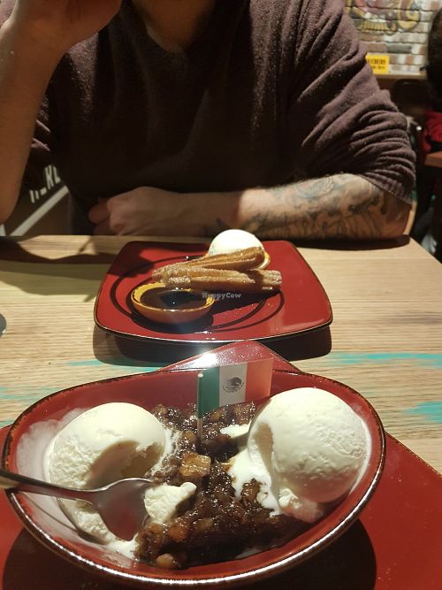 Vegan sticky date pudding with soy vanilla ice cream + vegan churros! at Montezuma's in Williams Landing