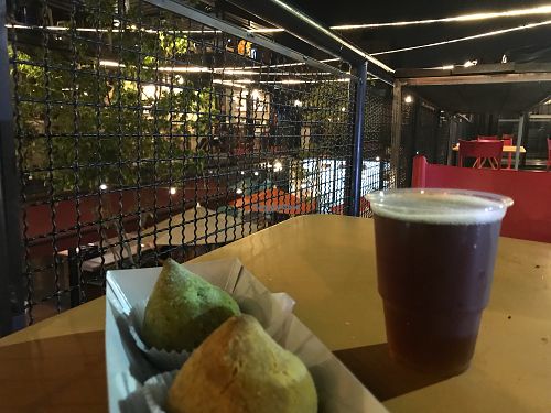 Two coxinhas (spinach and jaca) and mate at Acougue Vegano in Sao Paulo
