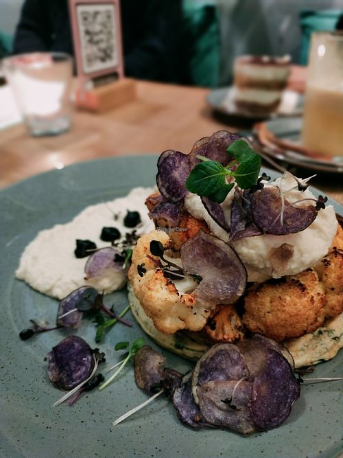 Roasted cauliflower with spinach pancake and garlic mash, purple crisps at Mana - Schöneberg in Berlin
