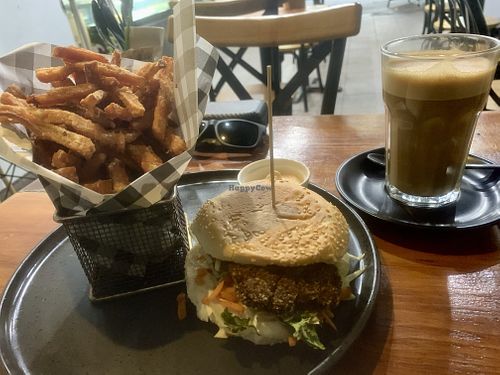 “Chicken” Schnitzel burger, sweet potato fries and sriracha mayo   at 108 Paradise Cafe - Maybe closed in North Sydney
