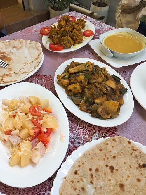 Pakoras, dal soup, mixed veg curry, parota, potato tomato salad, chapati at Namaaste Kitchen in Nyaungshwe