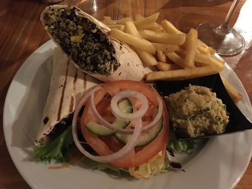 quinoa wrap with fries and salad at Mojitos Beach Terrace in Mellieha