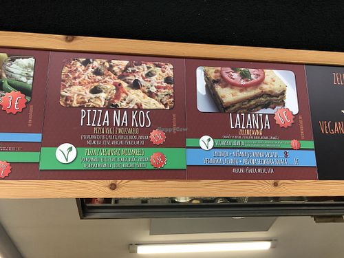 vegan pizza and lasagna menu at Radha Govinda Street Food in Ljubljana