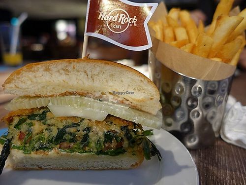 spinach, potato and chickpeas burger neatly sliced into 2  at Hard Rock Cafe - Orchard in Central Singapore