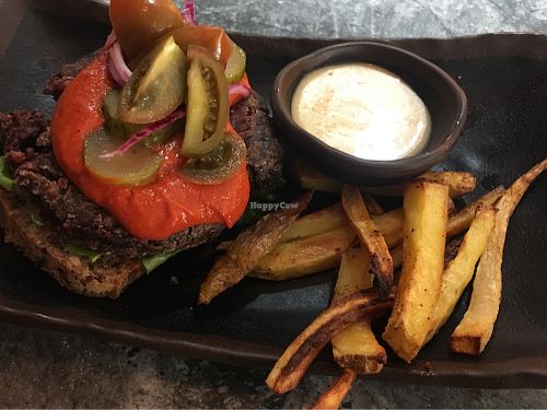 Vegan burger with friend roots at Glo in Copenhagen