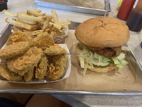 Vegan chicken burguer with fried pickles and fries  at Flippin' Good in Las Vegas