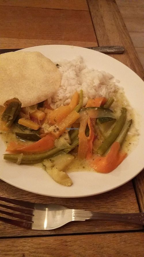 Thai green curry with rice and poppadoms at Peaky Blinders Bar  in Paignton