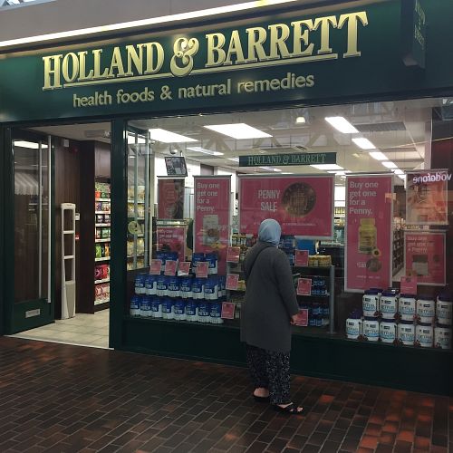 S hop exterior in shopping centre at Holland & Barrett in Gillingham