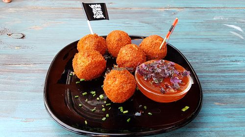 Mexican bitterballs with spicy sauce at Vegan Junk Food Bar - De Pijp in Amsterdam