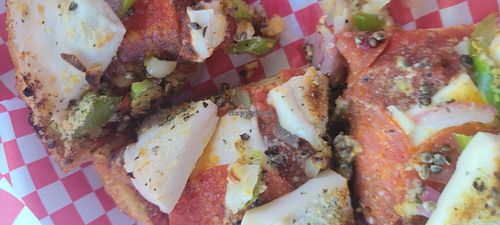 Deep dish pizza with homemade toppings at The Pizza Patio in Flagstaff