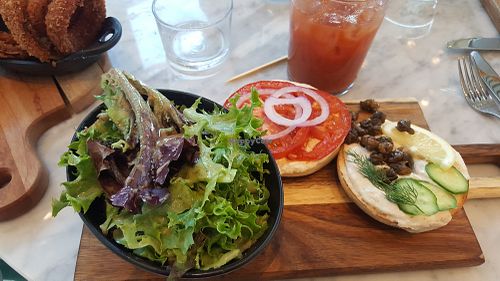Mixed greens and bagel lox with fried capers and nut cream cheese at LOV in Laval