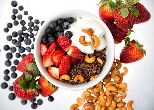 Quinoa granola - home made granola made with coconut oil cashews, sesame seeds and honey. Served with seasonal berries and a choice of almond milk or ricotta cheese at Fresco Gelateria in New York City