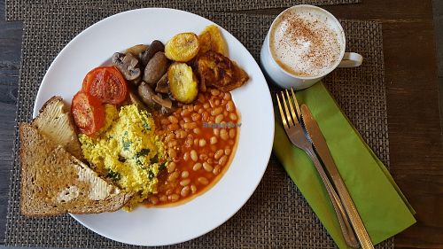 Cooked breakfast with an oat milk cappuccino  at Plantbase Cafe in South West London