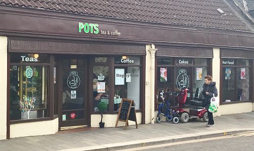 Long shopfront - lots of light inside. at Pots in Falkirk