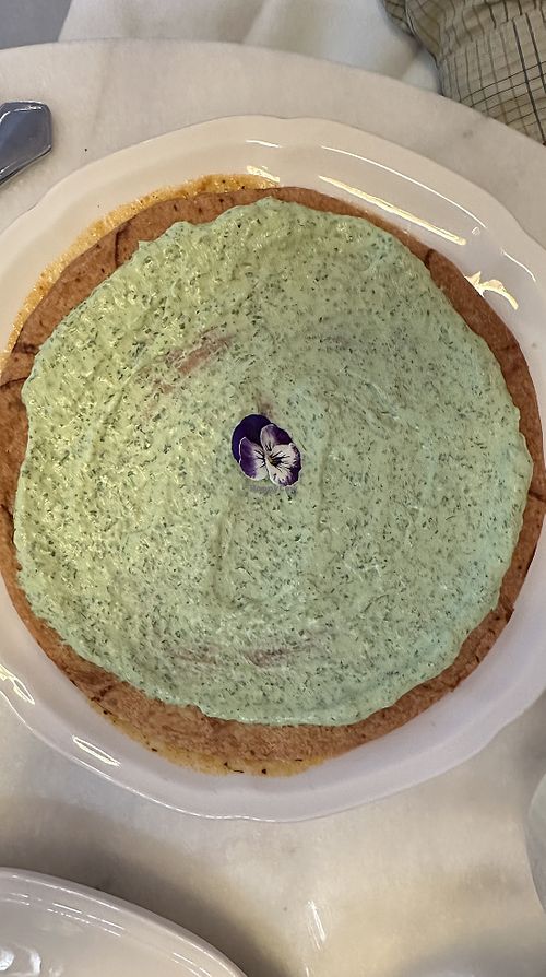 Vegetable saffron stew top with parsley crème covered pastryy  at Like An Elephant in Lyon