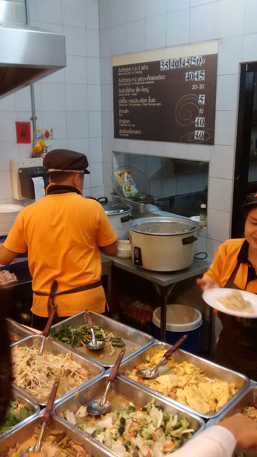 behind the counter at Vegetarian Food Stall - Ploenjit in Bangkok