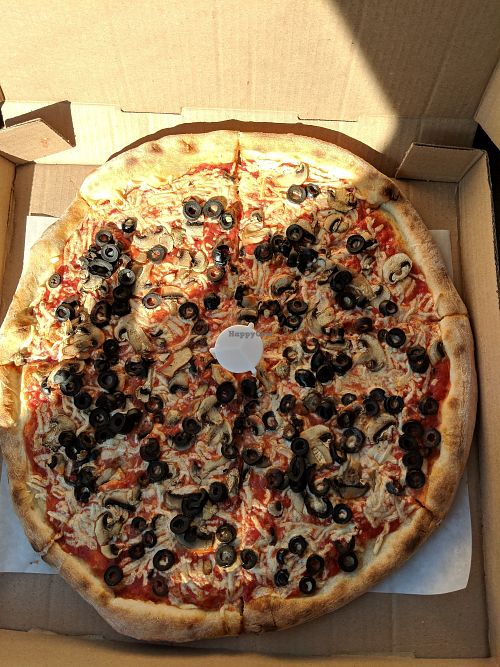 Pizza with daiya, olives, and mushrooms at 081 Pizza in Stony Brook