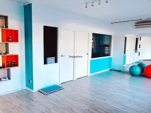 The studio, with a boxfit room in the back. Bright and happy colours.  at Holly Barber Personal Training in Barcelona