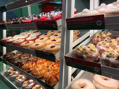 their 3 vegan flavours: red velvet, jam and chocolate with cookie dough  at Rodeo Doughnuts - Shaftesbury Ave in London