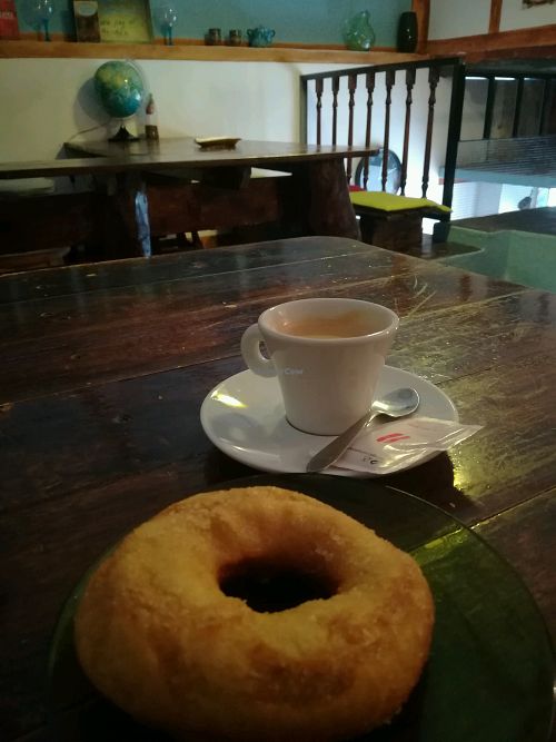 yum donut and coffee  at O Burrito in Porto