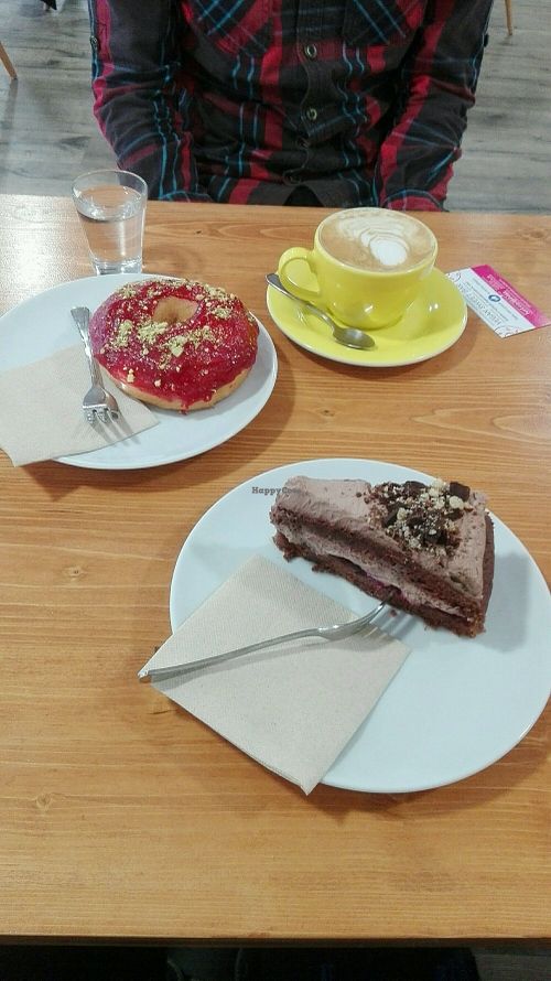 raspberry donut, chocolate cake and cappuccino with vanilla soy milk at Vegan Food & Sweet Bar in Brno
