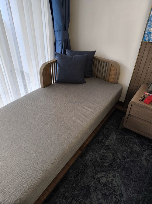 Chaise Lounge in room at Away Chiang Mai Thapae Resort in Chiang Mai