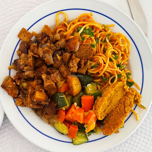 Pasta, seitan, vegetables, ginger vegetable paste. at A Colmeia in Lisbon