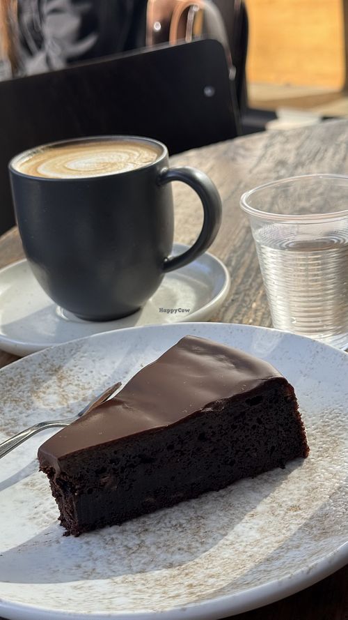 soy milk coffee and vegan chocolate cake #Veganuary at Loveat - Dizengoff in Tel Aviv
