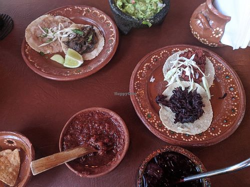 four varieties of vegan (ized) tacos - hibiscus, refried bean, mushroom and soya chorizo at Tacos Revolucion in Puerto Vallarta