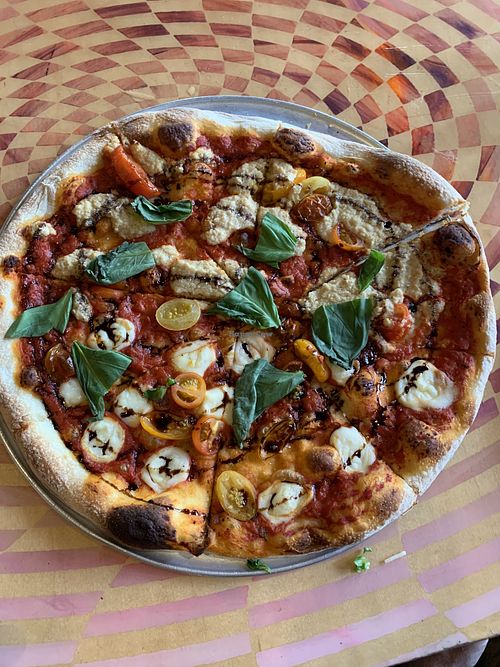Caprise pizza with half house-made vegan mozzarella and half cashew ricotta…both were excellent!   at City O' City in Denver