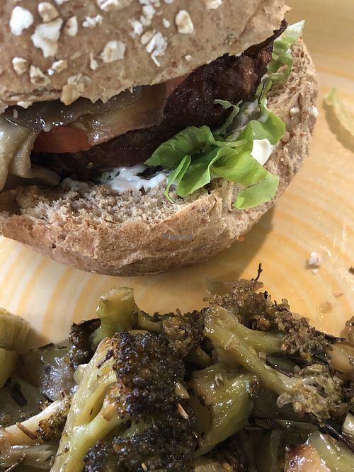 Beyond Meat and aubergine burger and broccoli as a side at L'Orto Bistrot in Turin