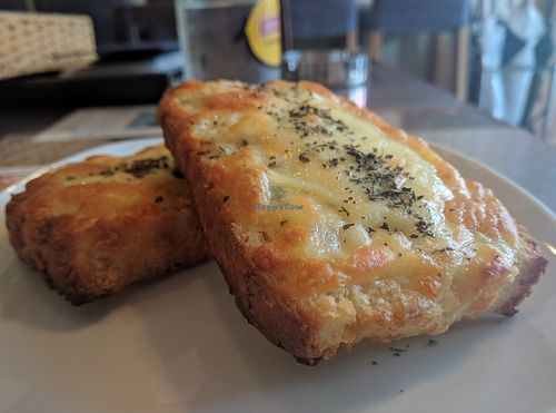 Crispy with more salty herb flavor than garlic- but very good! at Slices in Osaka