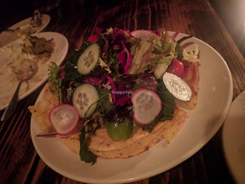 CAST IRON SOCCA. (MARKET GREENS. GREEN HERB PUREE. AVOCADO. ) at XYST in New York City