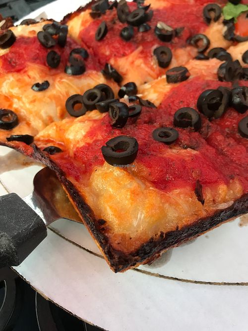 black olive Detroit style pizza with vegan cheese at Carriage Court Pizza in Crown Point