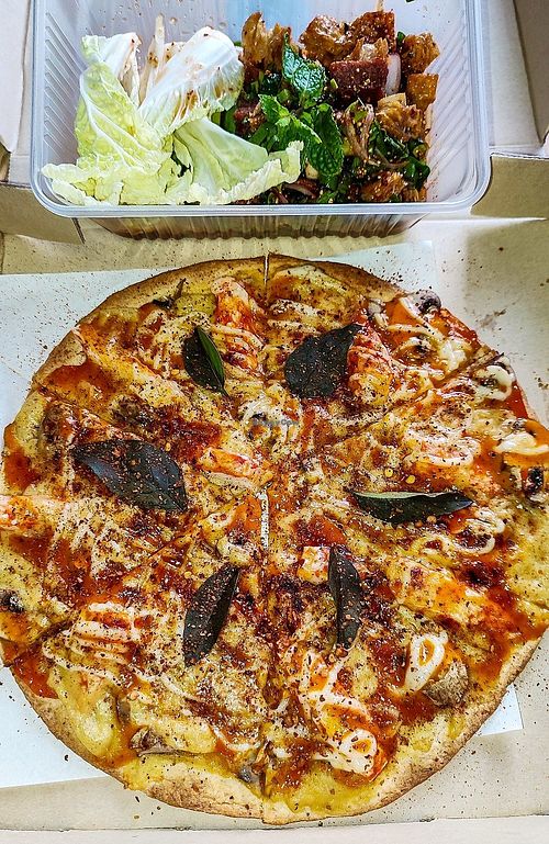 Tom Yum Pizza and Spicy Crispy Duck Salad. Delivery. at Yes Vegan in Pattaya