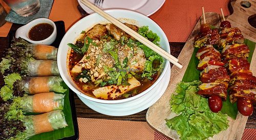 Salad rolls, spicy noodles and BBQ kabobs. at Yes Vegan in Pattaya