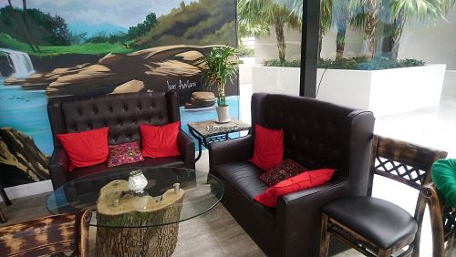 Inside comfy seating at Artichoke & Vine in Boca Raton