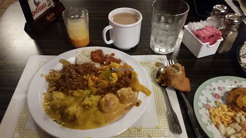 We visited this Indian Restaurant in Mesa, AZ on Dec 1, 2017 for the first time, It’s a nice place, with a dinner buffet. There are clearly marked portions of the buffet for Vegan options.
The food all tasted great, they had many Vegan options, but also some meat. They bring fresh made breads to the table as you eat. There was chai tea & mango juice as well as some sweets. Friendly staff. They were open late 10pm

More Pics 
http://whatdoyoueatthen.com/india-oven-mesa-az/ at India Oven in Mesa