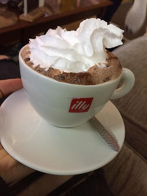 Hot chocolate with vegan cream and marshmallows underneath!  at Purple Cat Cafe in Glasgow