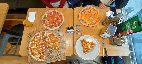 The big pizza is Large Superseitan pizza (V) at Kotipizza in Helsinki