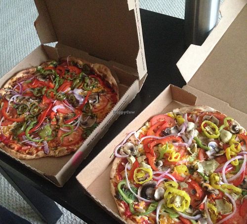 Two vegan pizzas to-go, topped with veggies at Pie Five Pizza in Washington