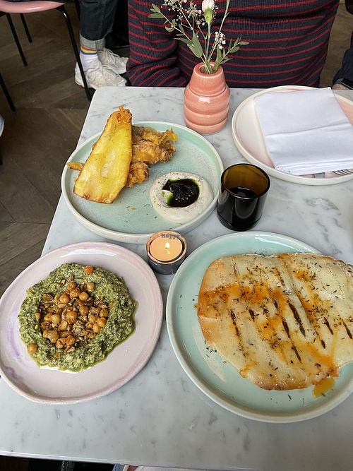 Parsley root tempura, Jalapeño aioli, kelp caviar and Avocado, pistachio, Thai basil dip with flat bread.  at Yes Yes Yes in Helsinki