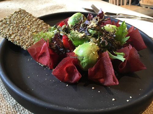 Raw ravioli filled with almond cheese (inside) and with a pesto sauce at Rawdical Vegan Kitchen in Santiago