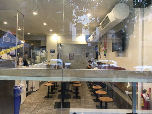 Inside of restaurant, showing utilitarian type seating at Xi'an Famous Foods - Upper East Side in New York City