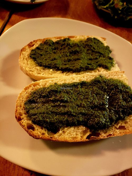 Bread with housemade vegan pesto at La Semilla in Puerto Maldonado