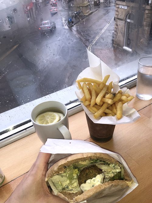 Full pita and salad, chips and hot lemon water at Falafel Mama in Stroud